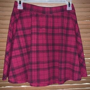 Here we have a plaid burgundy knee length skirt that is perfect for any occasion